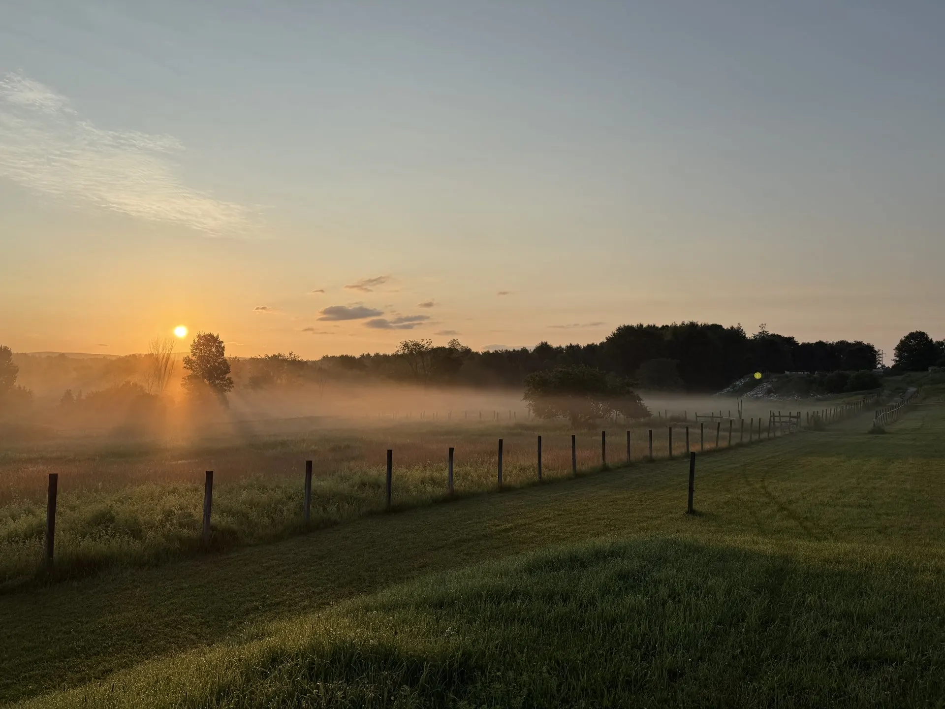 Morning mist rising over the Colchester pastures at sunrise